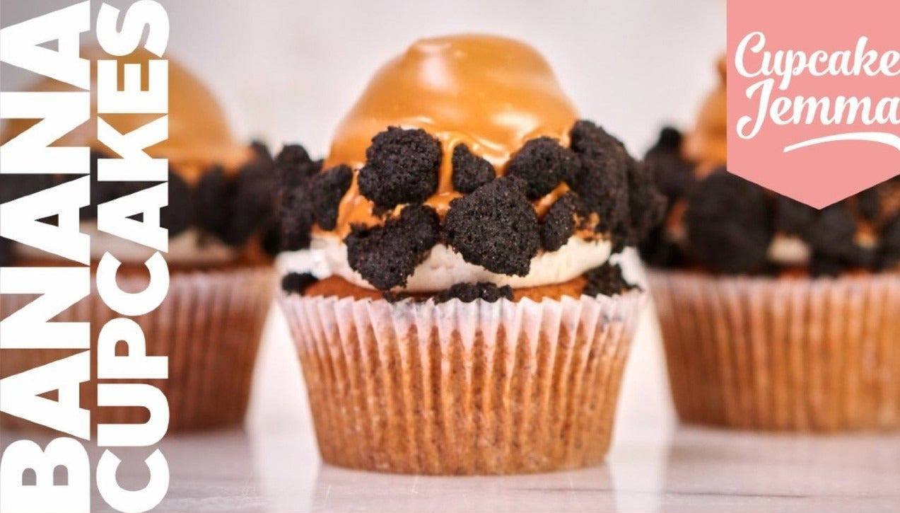 Close-up of a banana cupcake topped with banana caramel and chocolate crumbs from Banana Cupcakes downloadable recipe by Cupcake Jemma