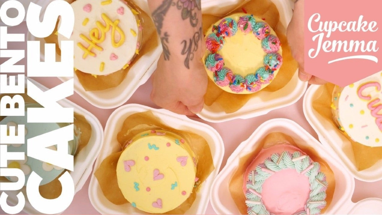 Top view of colorful decorated bento cakes with ingredients list for Cupcake Jemma Bento Cakes downloadable recipe.