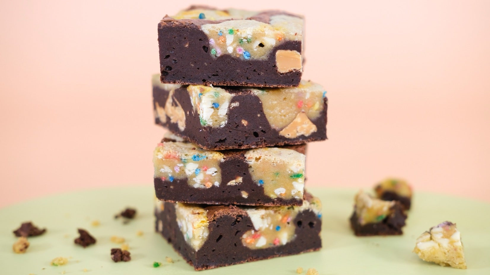 Stack of Birthday Brookies with brownie and cookie layers topped with colorful sprinkles and recipe ingredients list below