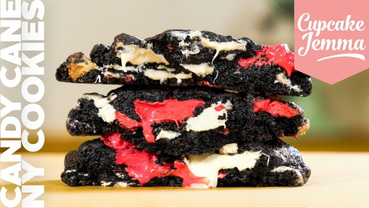 Stack of dark chocolate Candy Cane New York Cookies with red and white candy pieces in a baking recipe by Cupcake Jemma