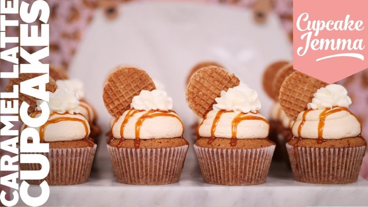 Row of caramel latte cupcakes topped with cream, caramel drizzle, and waffle biscuit from Cupcake Jemma recipe download