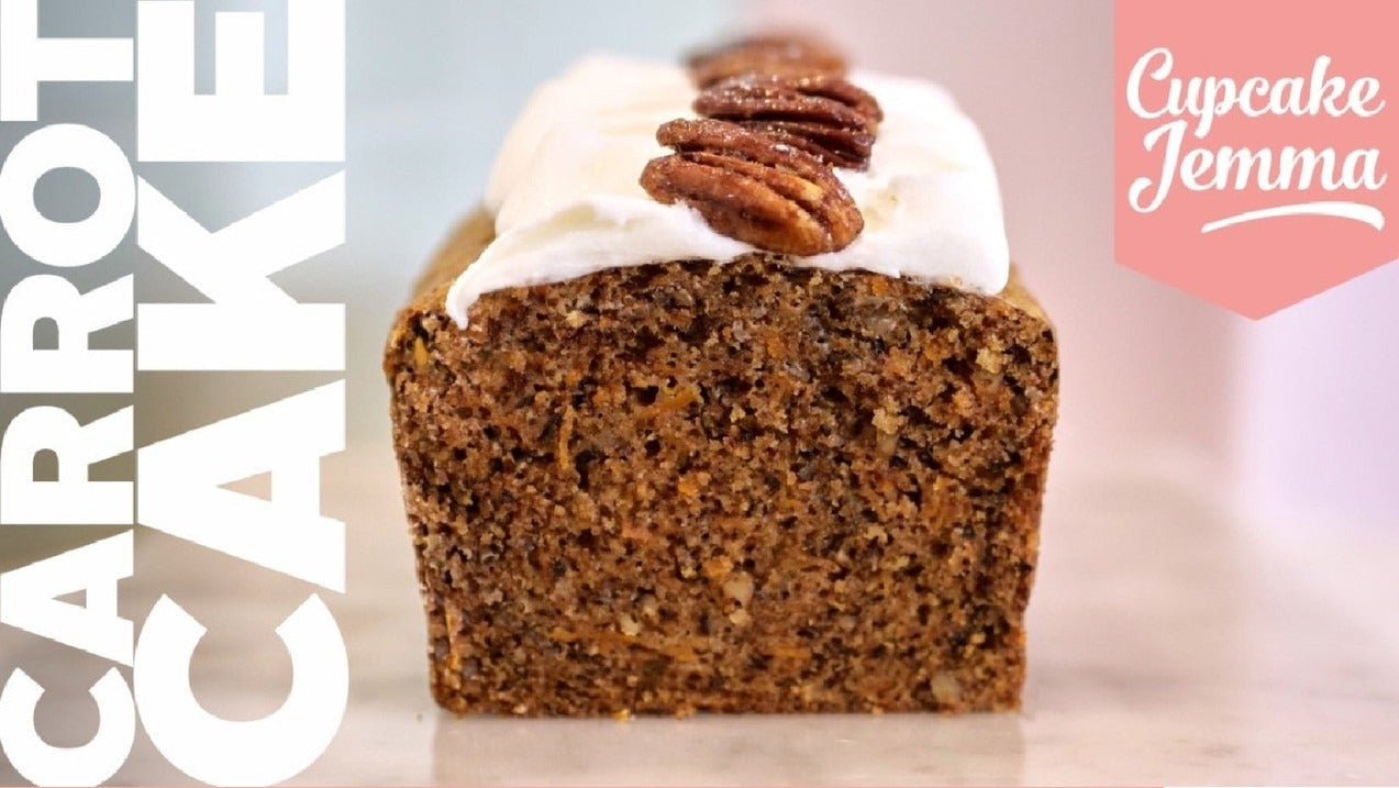 Carrot Loaf Cake with cream cheese frosting topped with pecans from Cupcake Jemma downloadable recipe card.