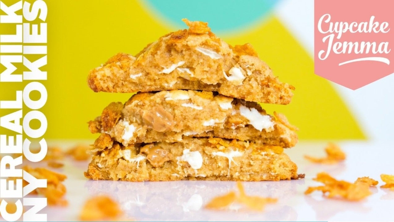 Stack of three soft and chewy Cereal Milk New York Cookies with visible white and caramelized chocolate chunks next to recipe text