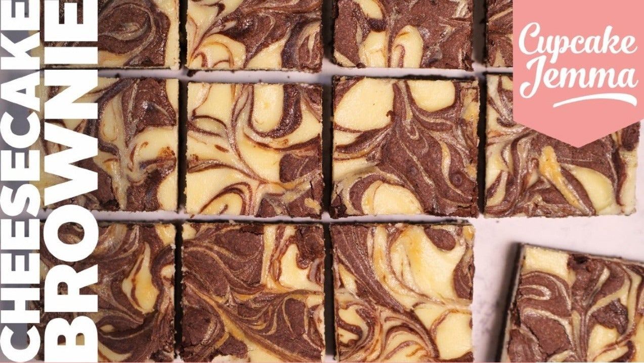 Close-up of sliced cheesecake brownies with swirled chocolate and cream cheese layers for Cheesecake Brownies downloadable recipe by Cupcake Jemma