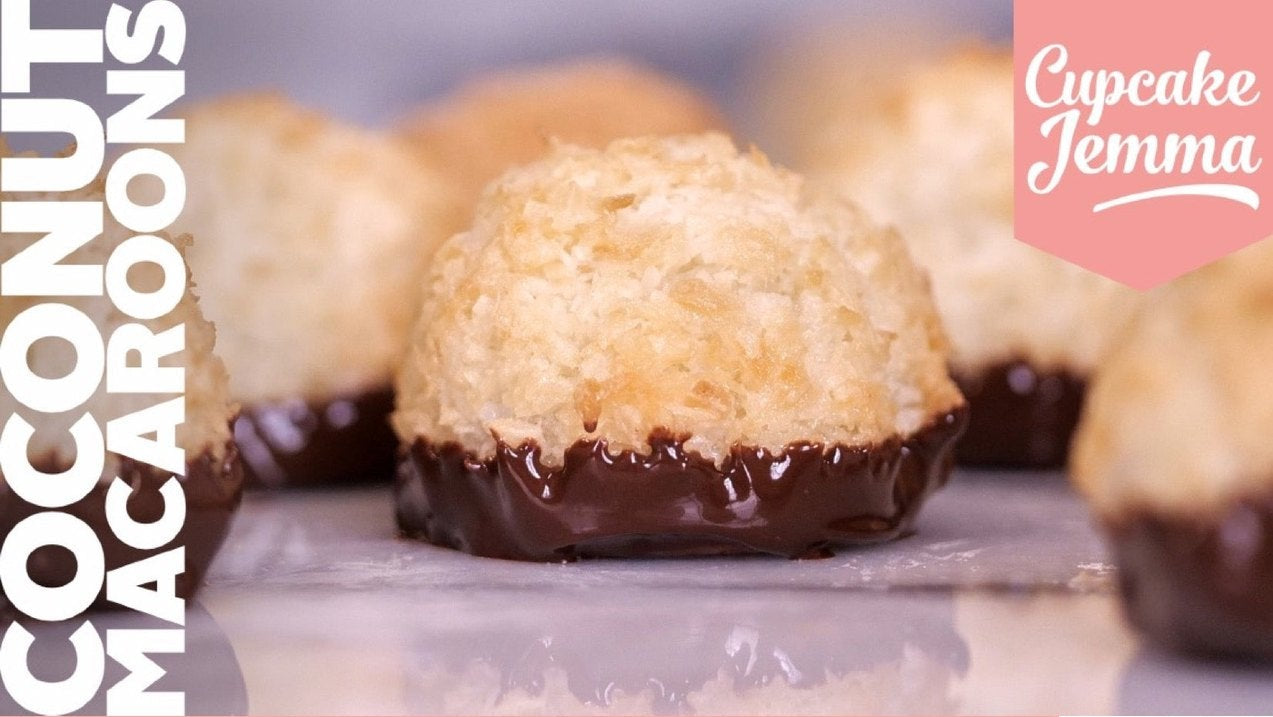 Close-up of coconut macaroons dipped in dark chocolate with recipe ingredients by Cupcake Jemma for baking enthusiasts