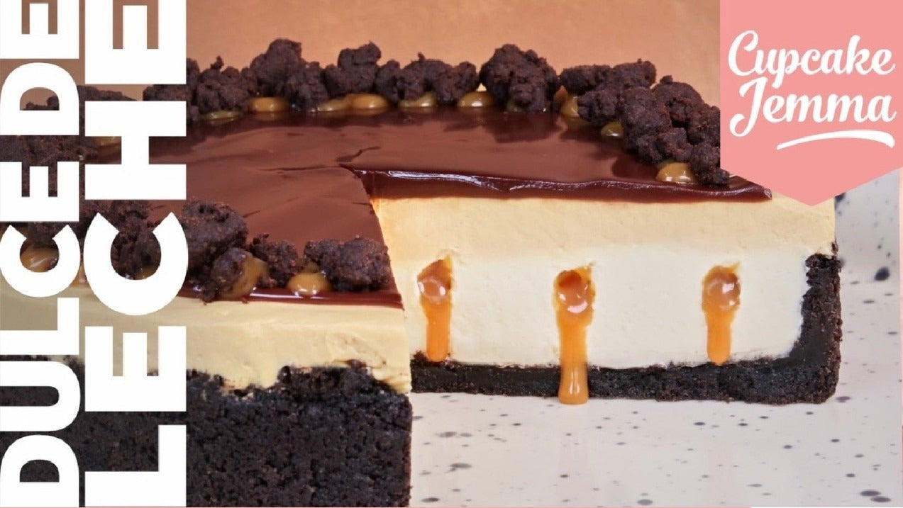 Close-up of Dulce De Leche Cheesecake with chocolate ganache and caramel drizzle from Cupcake Jemma recipe download.