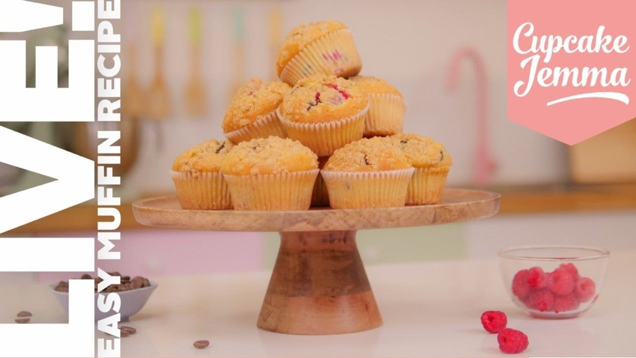 Stack of golden easy muffins on a wooden cake stand for the Easy Muffin downloadable recipe by Cupcake Jemma