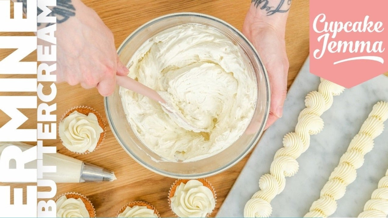 Hands mixing creamy Ermine Buttercream in a bowl with cupcakes and piping demonstration beside it, recipe by Cupcake Jemma