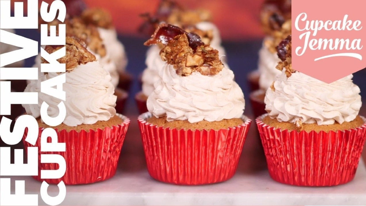 Close-up of festive cupcakes with creamy frosting and granola topping featured in Cupcake Jemma baking recipe download.