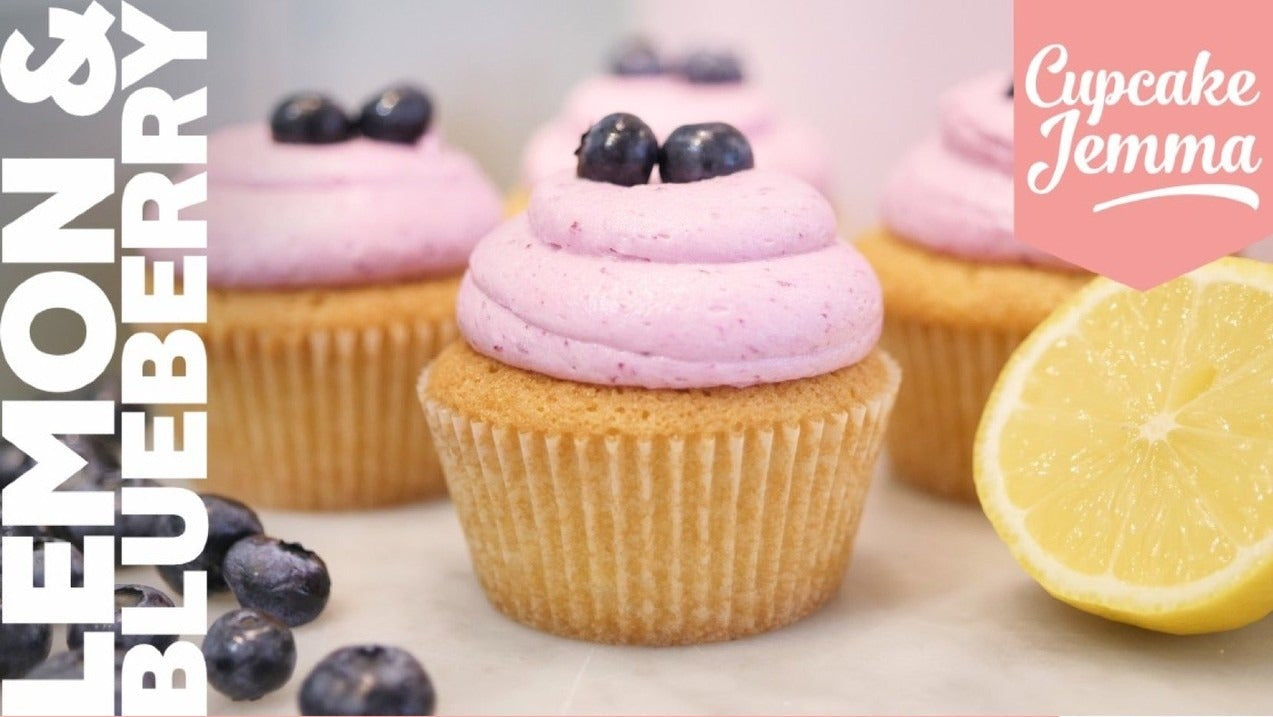 Lemon & Blueberry Cupcakes with pink frosting and blueberries showcasing Cupcake Jemma’s downloadable baking recipe.