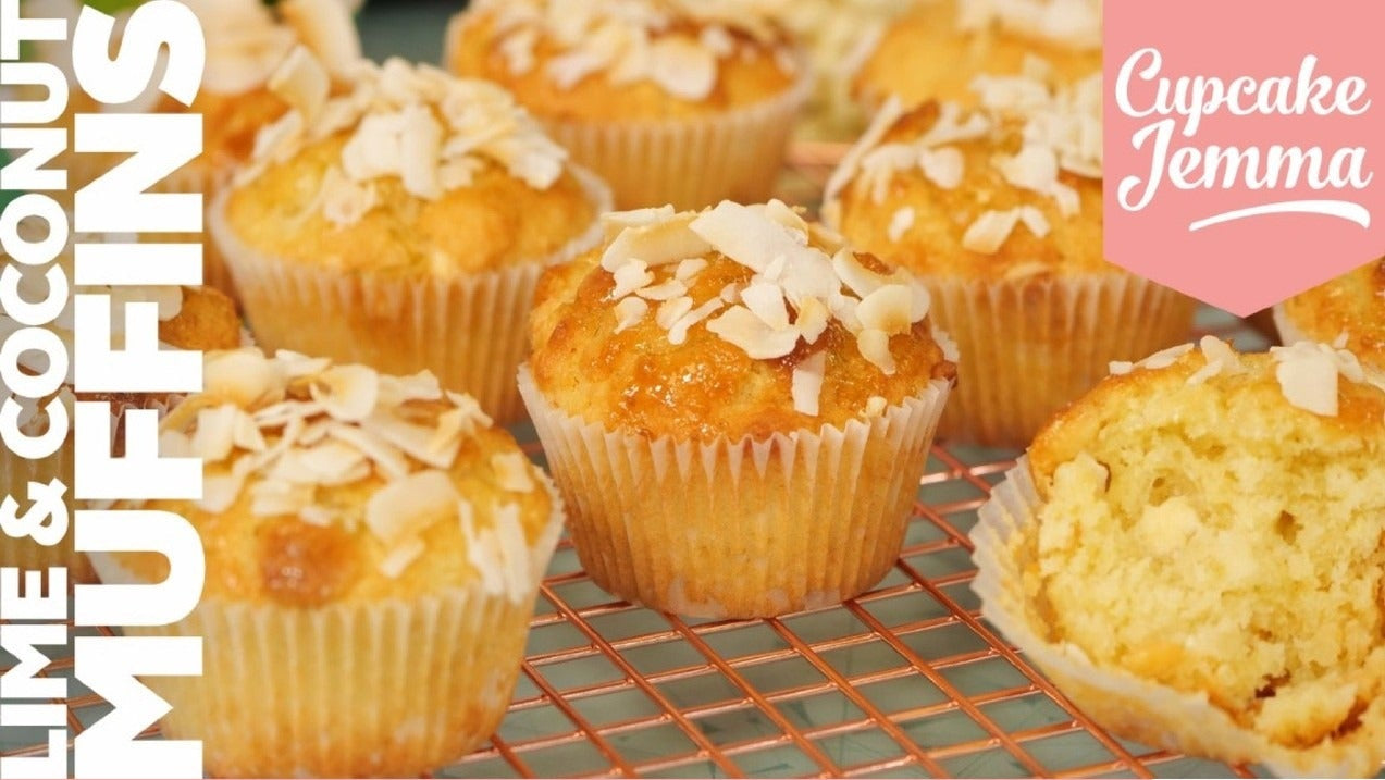 Close-up of freshly baked lime and coconut muffins topped with coconut chips from Cupcake Jemma recipe guide