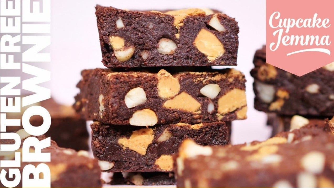 Stacked gluten free brownies with macadamia nuts and caramelised white chocolate from Cupcake Jemma recipe guide.
