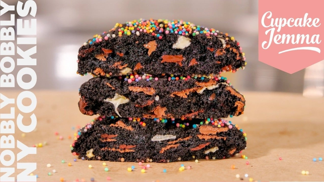 Stacked Nobbly Bobbly New York Cookies with colorful sprinkles, showcasing Cupcake Jemma’s downloadable baking recipe.