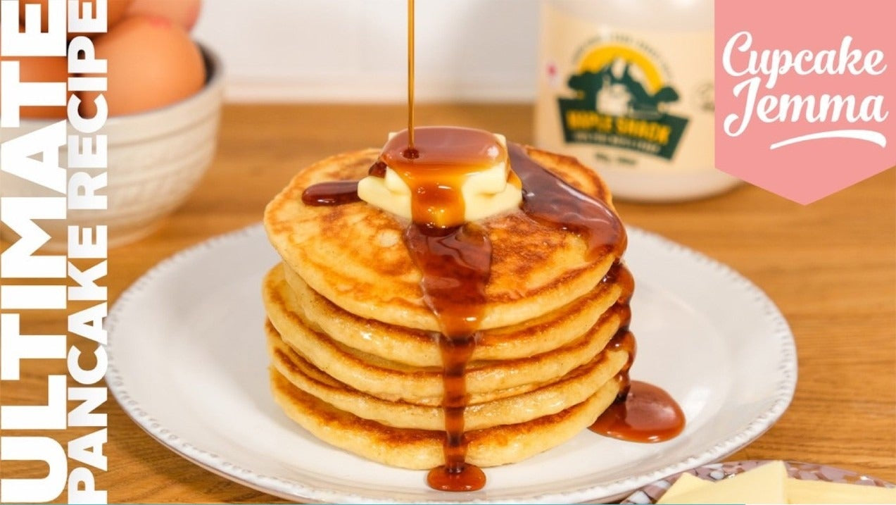 Stack of fluffy pancakes with butter and syrup, featured in Pancakes downloadable recipe by Cupcake Jemma.