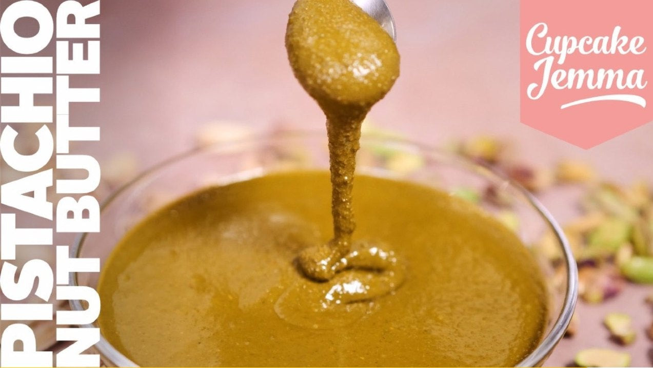 Smooth pistachio nut butter dripping from a spoon over a bowl with recipe ingredients text on the side