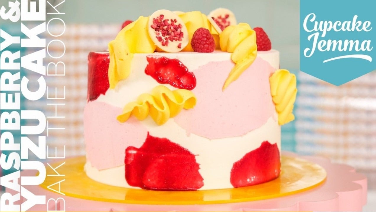 Raspberry & Yuzu Cake downloadable recipe by Cupcake Jemma featuring a decorated layered cake with white chocolate discs.