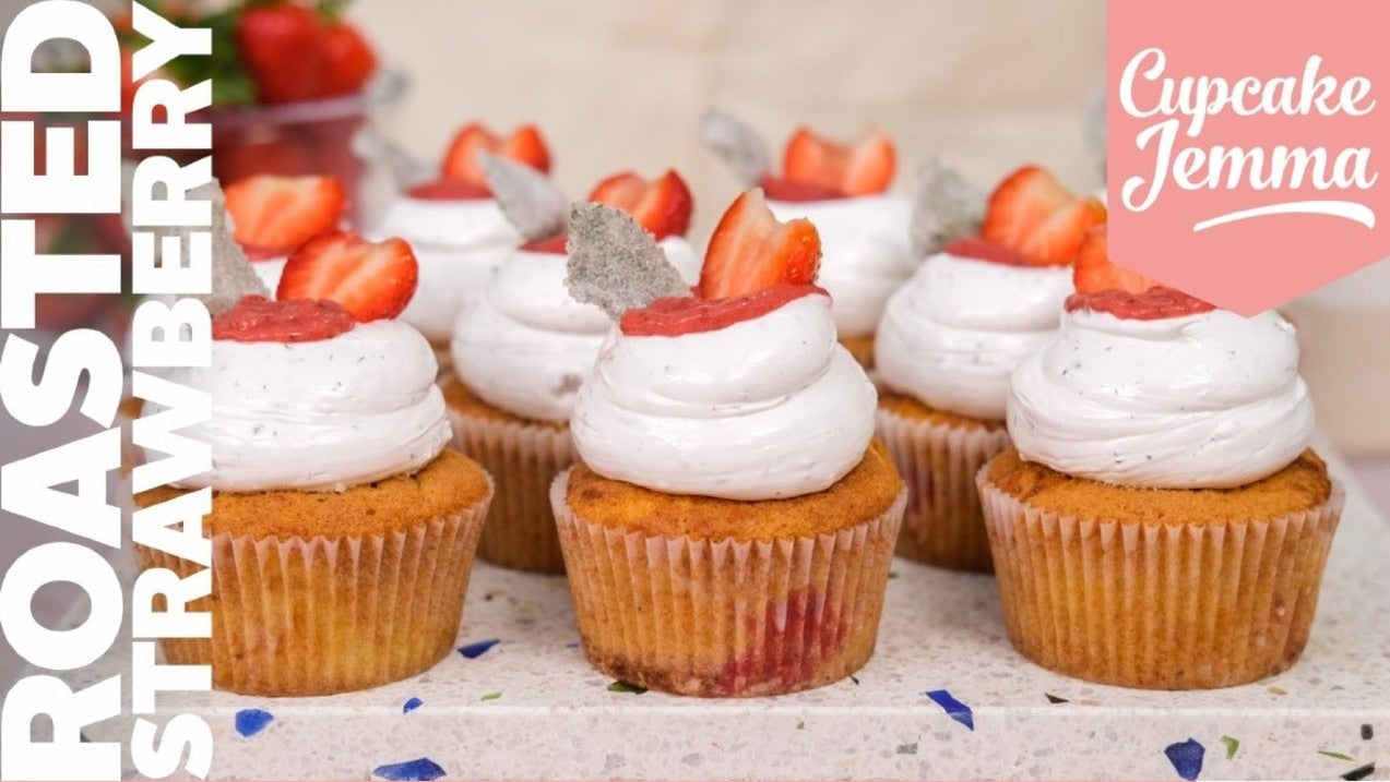 Close-up of Roasted Strawberry & Mint Cupcakes with creamy frosting and fresh strawberry garnish by Cupcake Jemma recipe.