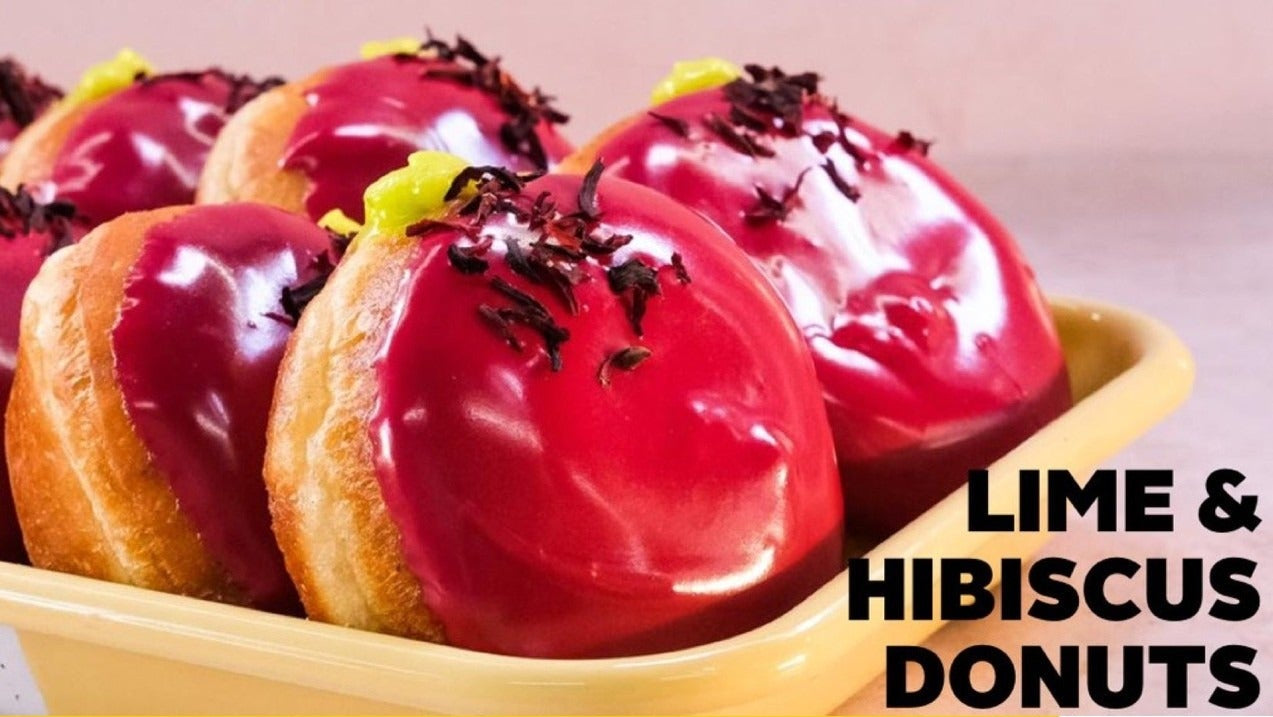 Close-up of glossy lime and hibiscus donuts with recipe ingredients for Sally's Lime & Hibiscus Donuts downloadable recipe.