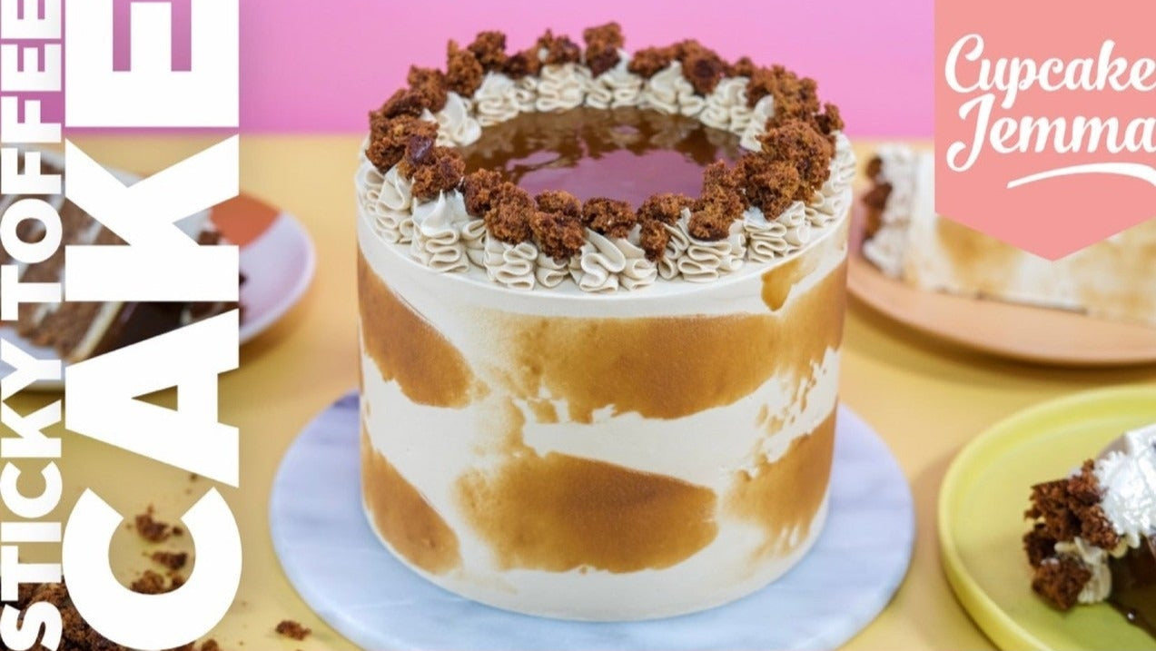 Cupcake Jemma Sticky Toffee Cake downloadable recipe with rich sponge and creamy frosting on a blue cake stand