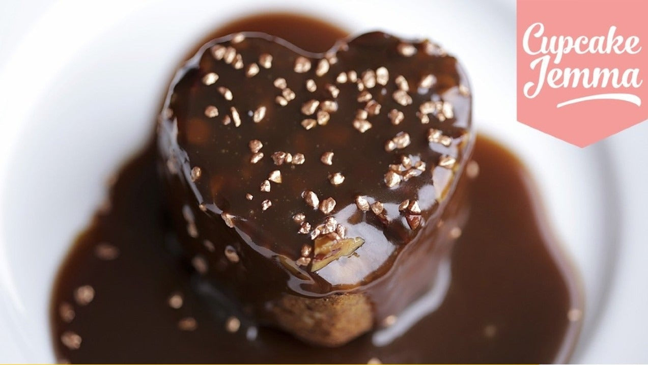 Close-up of heart-shaped sticky toffee pudding covered in rich toffee sauce from Cupcake Jemma recipe download