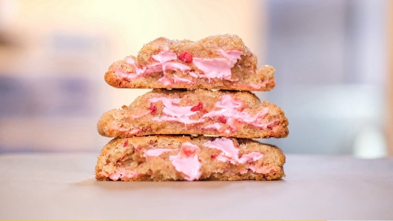 Strawberry Shortcake Cookies with creamy strawberry filling stacked, recipe ingredients list below in yellow and teal design.