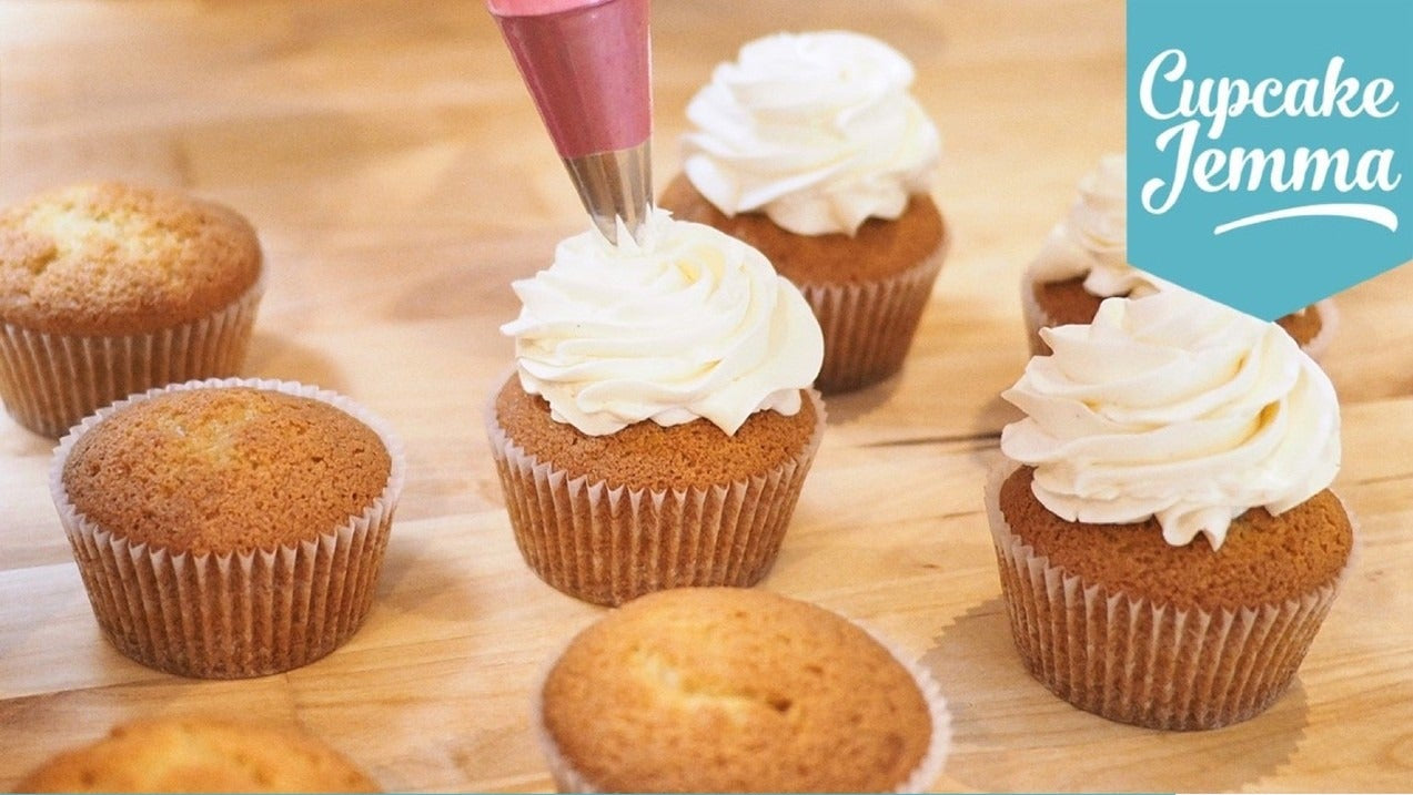Cupcake Jemma piping Swiss Meringue Buttercream frosting on cupcakes with recipe ingredients listed below
