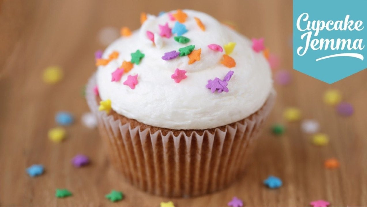 Vanilla Cupcakes downloadable recipe by Cupcake Jemma showing a frosted cupcake with colorful sprinkles and ingredients list.