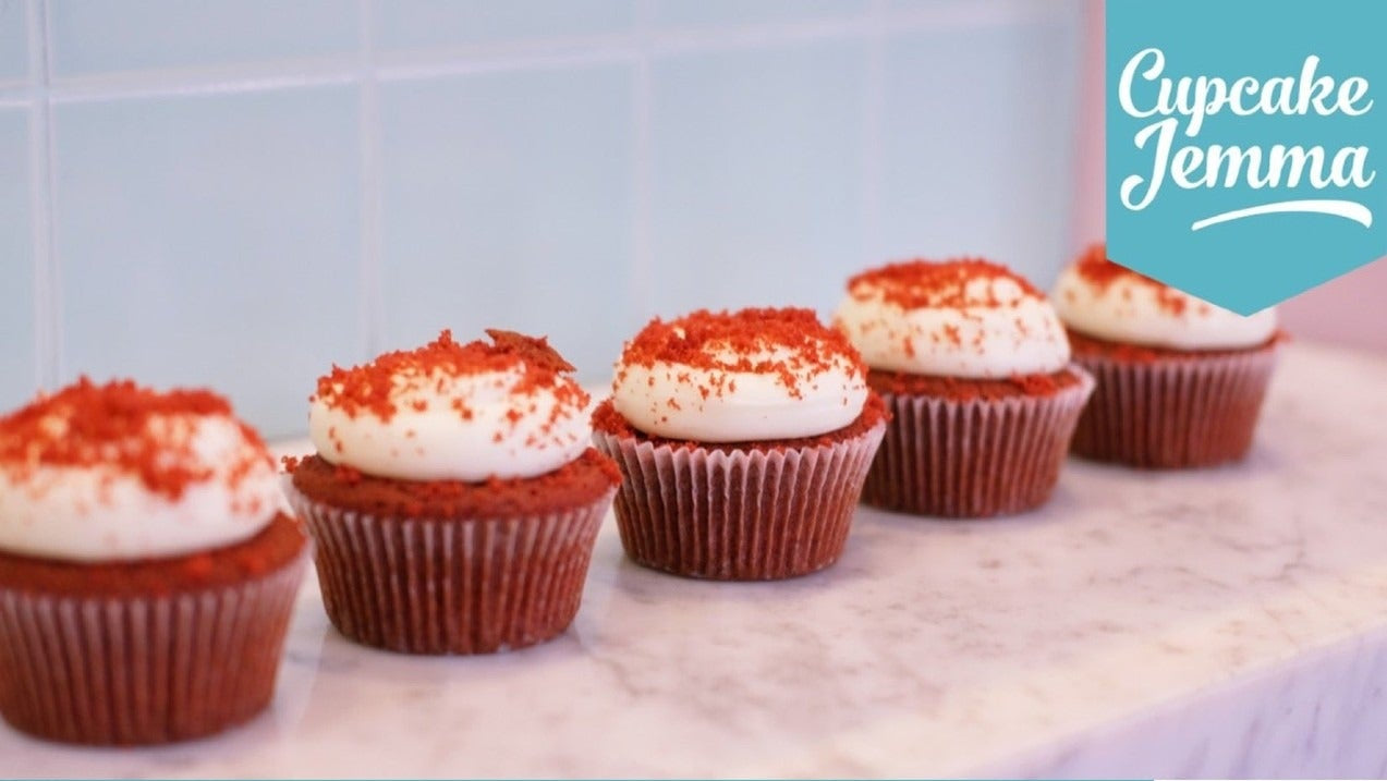 Row of Vegan Red Velvet Cupcakes with frosting by Cupcake Jemma and ingredient list for downloadable recipe.