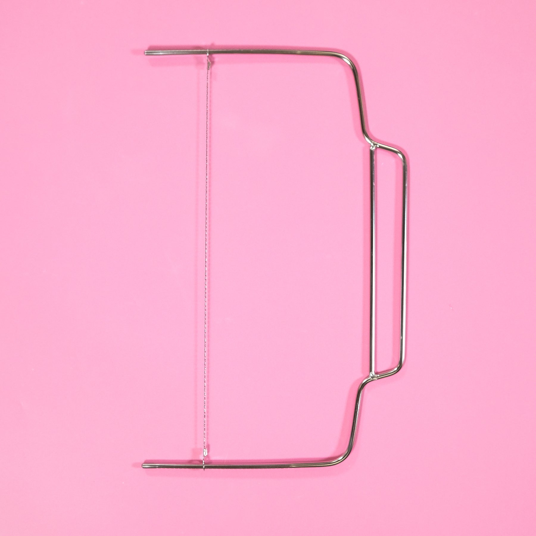 Cake Leveller with adjustable wire for even cake layers, perfect for precise baking and decorating tasks