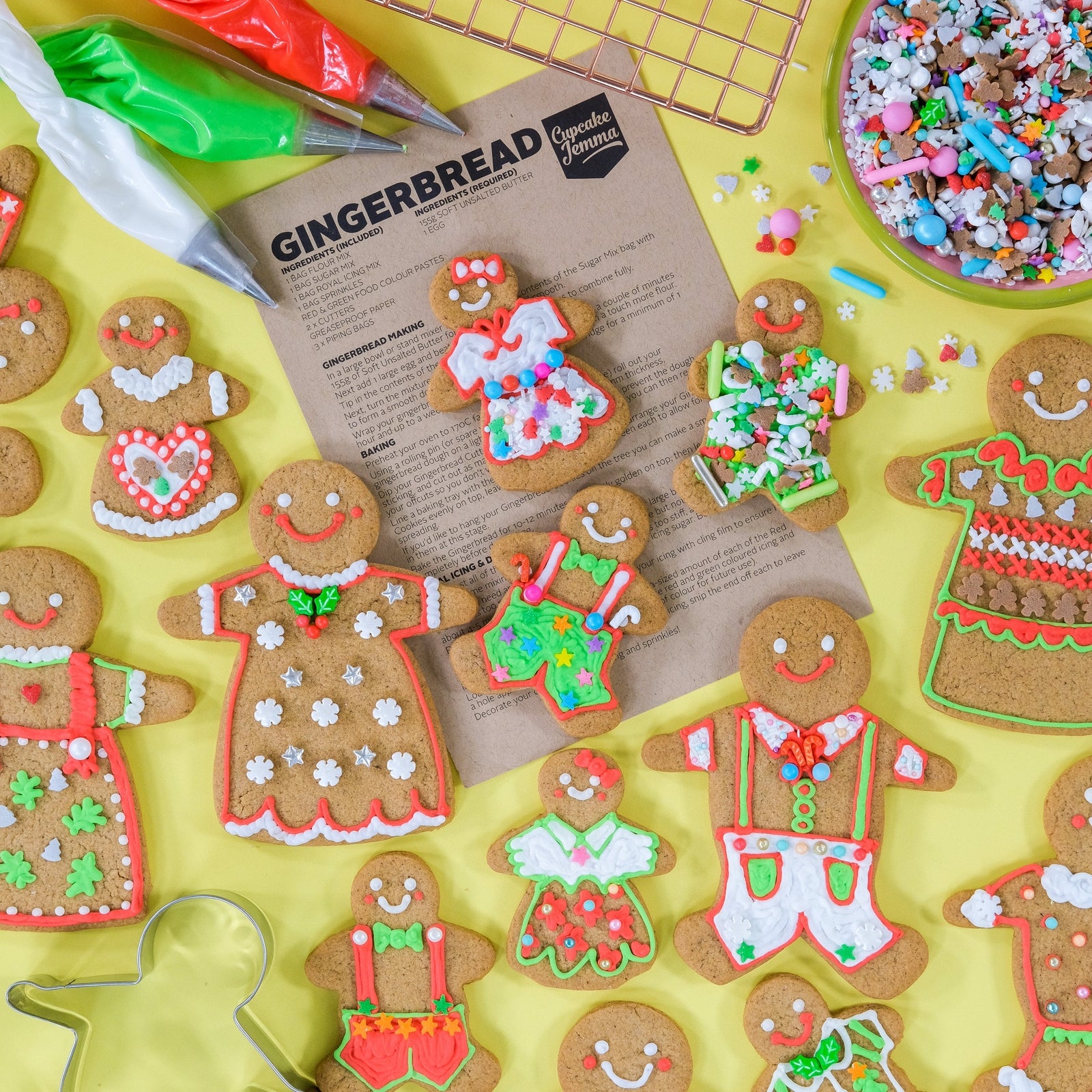 Gingerbread Person Baking and Decorating Kit with decorated cookies, icing bags, sprinkles, and recipe sheets by Cupcake Jemma